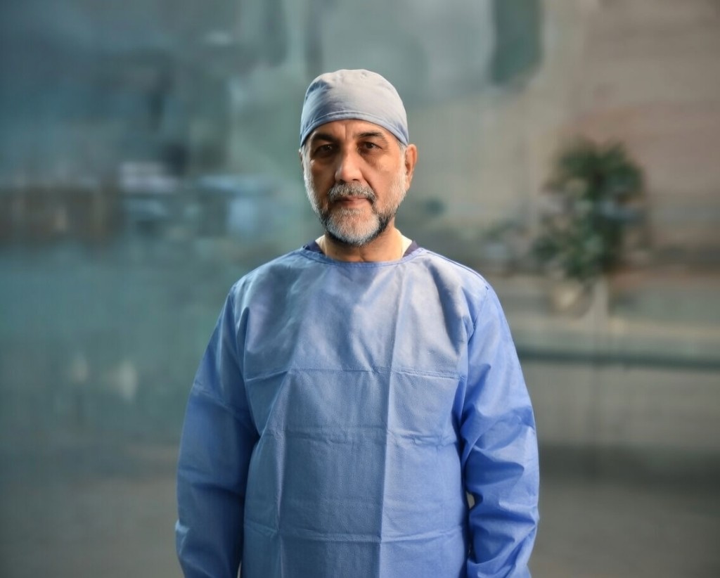 Dr. Nusrat Ullah Khan in surgical attire at Al-Mustafa Laser Eye Clinic