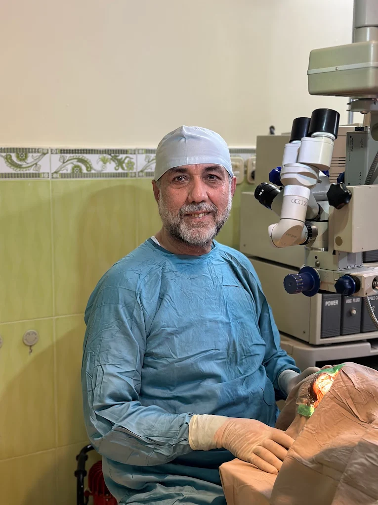 Eye surgeon at the microscope performing advanced microsurgical vision correction